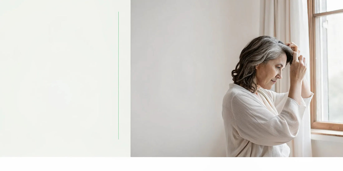Woman gently examining her hair after weight loss