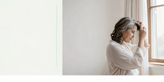 Woman gently examining her hair after weight loss