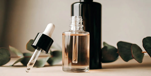 A premium glass dropper bottle with topical solution for scalp hair growth