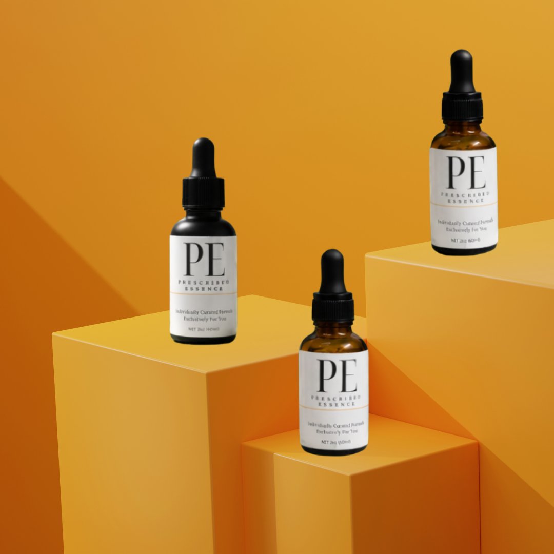 Three Prescribed Essence bottles on orange steps