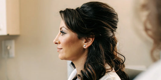 Woman with healthy voluminous hair in a clinical telehealth setting